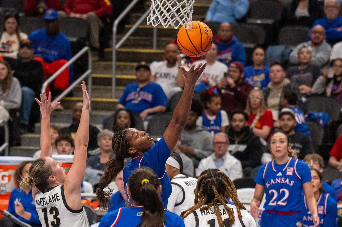 Kansas Jayhawks guard S'mya Nichols (12) shoots a layup in the second half of the Jayhawks first round game of the Big 12 Women's Basketball Tournament on Thursday, March 5, 2026, at T-Mobile Center.