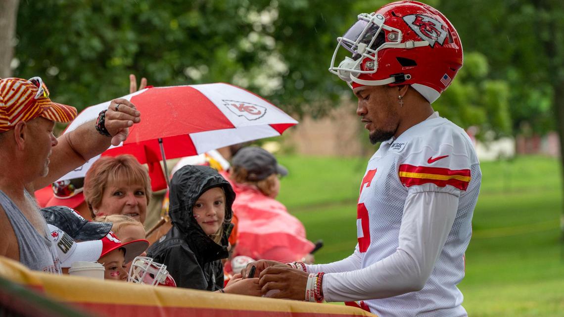Kansas City Chiefs safety Bryan Cook signs autographs for fans before practice at Chiefs training camp on Thursday, July 28, 2022, in St. Joseph.