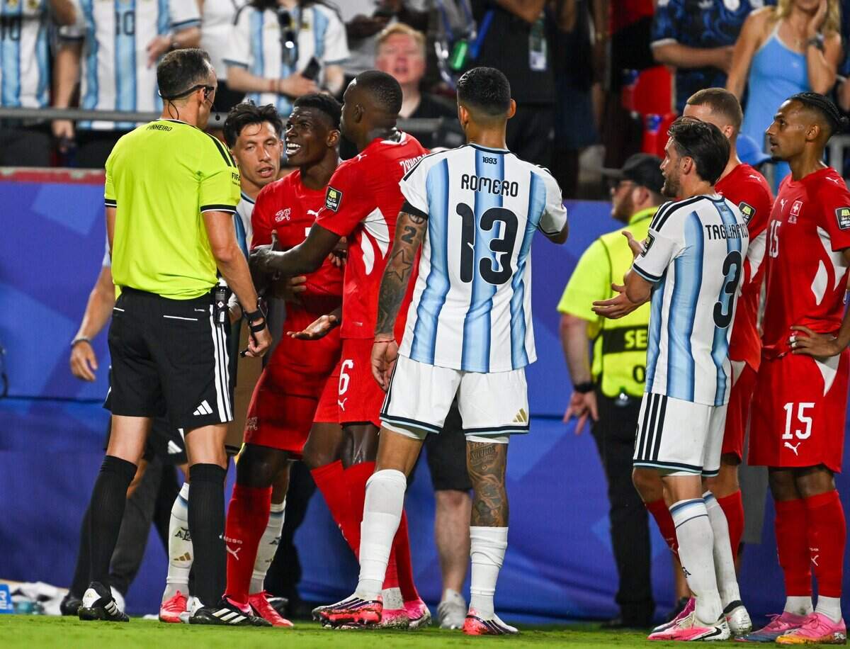 Switzerland forward Breel Embolo (7) pleads his case with the match official before being penalized with his second yellow card, which marked his sending off against Argentina in a 2026 World Cup quarterfinal football match at Kansas City (Arrowhead) Stadium on Saturday, July 11, 2026.