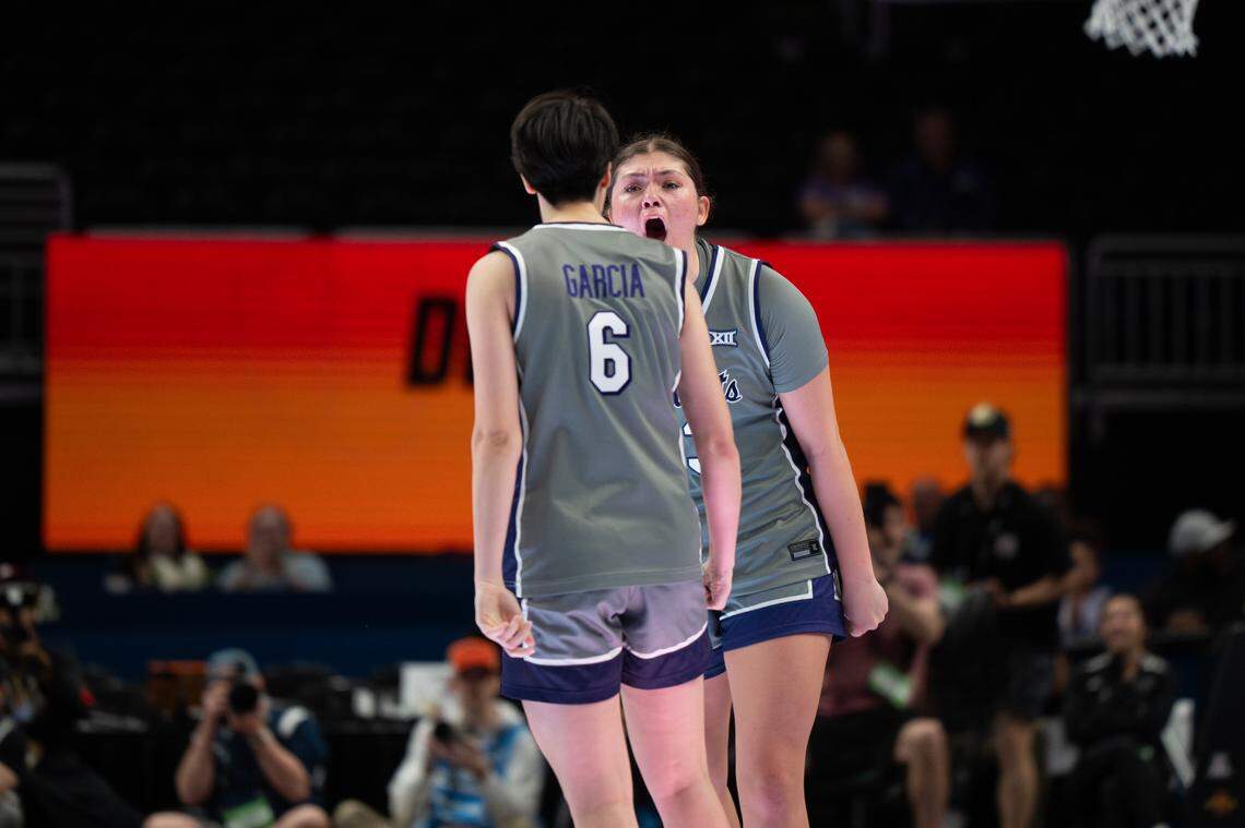 Kansas State Wildcats guard Jordan Speiser (23) celebrates with guard Gina Garcia (6) after a timeout was called against Oklahoma State during the Big 12 Women’s Basketball Tournament.