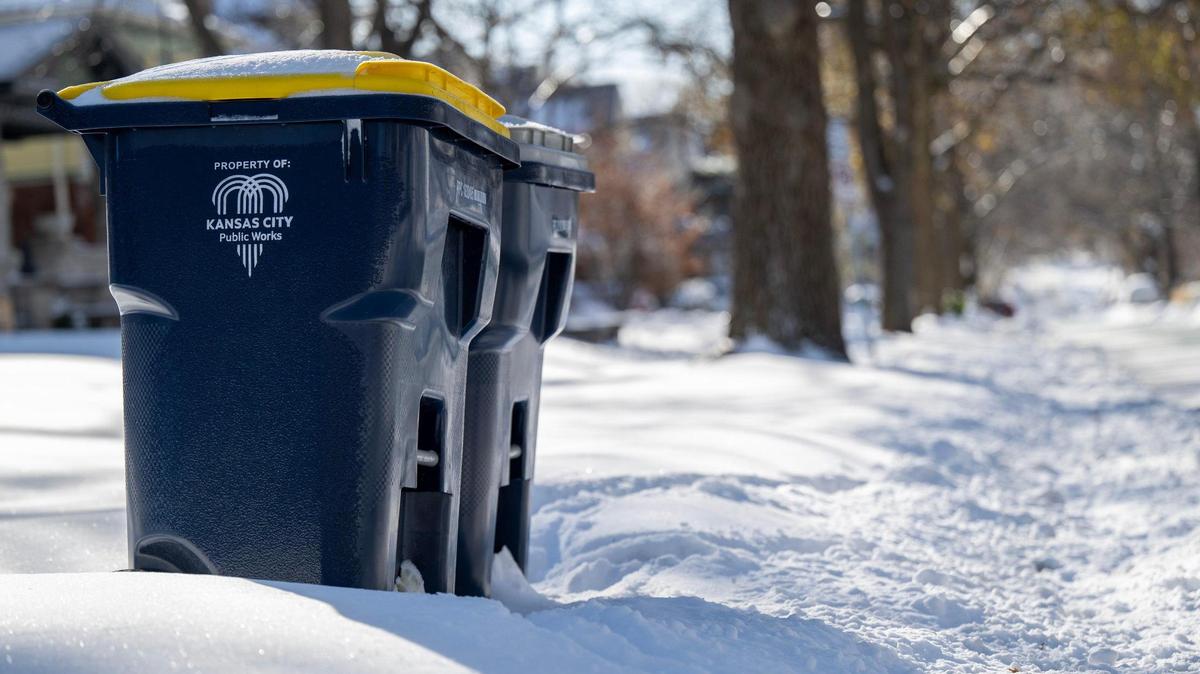 Kansas City Public Works trash bins are set out on the snow-covered streets for pickup on Monday, Jan. 6, in Kansas City. Trash pickup did not happen due to the snowstorm. When else will trash be delayed?