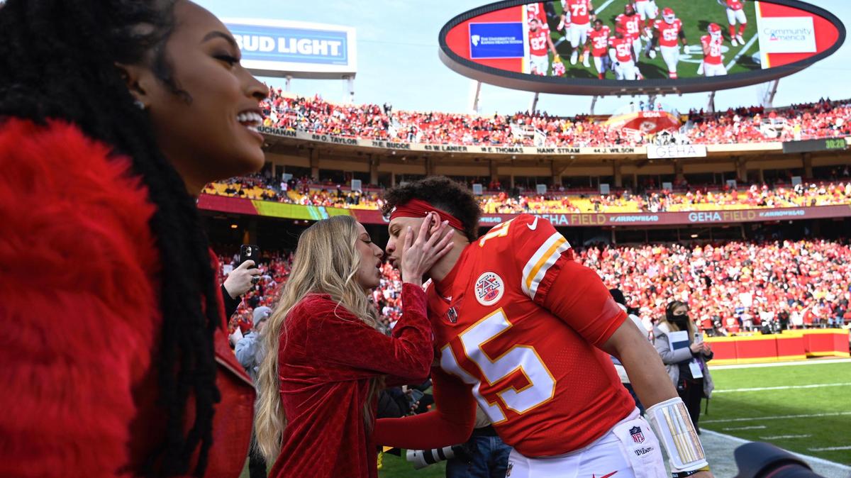 Kansas City Chiefs quarterback Patrick Mahomes gets a kiss from his fiancee Brittany Matthews before the AFC Championship Game against the Cincinnati Bengals on Sunday at Arrowhead Stadium.