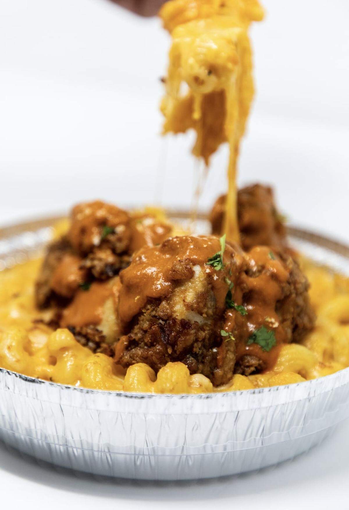 The Buff Baby Mac with marinated and twice-fried chicken, topped with its Bussin’ Buffalo sauce which is blended with garlic and peppers.