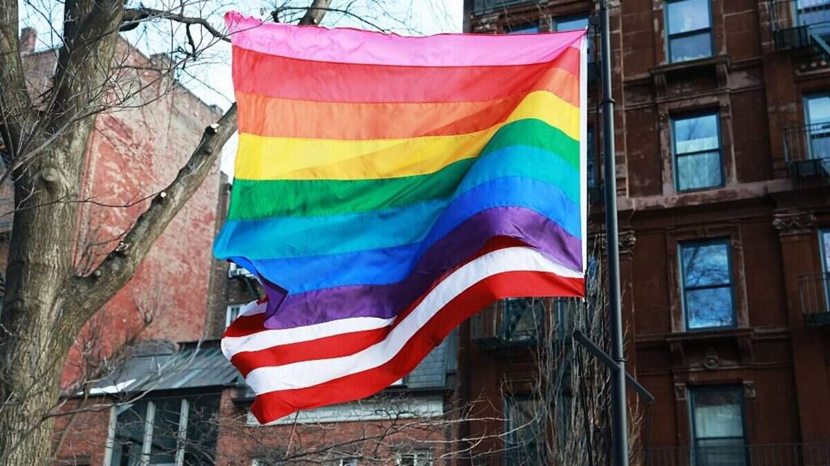 NEW YORK, NEW YORK - FEBRUARY 12: The American Flag flies with the Pride flag after local politicians and activists put up a LGBTQ+ Pride flag at the Stonewall National Monument after the Trump administration had the National Park Service remove it earlier in the week on February 12, 2026, in New York City. Hundreds gathered at the park in protest and to watch the flag be reinstalled at the site, which is considered the birthplace of the modern LGBTQ+ rights movement. The monument recognizes The Stonewall Inn, a legendary Manhattan gay bar that was the site of a 1969 uprising credited as a turning point in the modern LGBTQ rights movement. The decision to take down the flag has drawn backlash from national civil rights groups, LGBTQ+ advocates, and New York officials. (Photo by Spencer Platt/Getty Images)