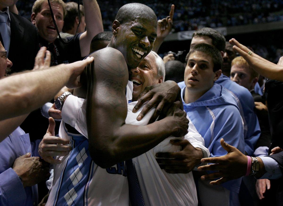 UNC’s Marvin Williams celebrates the Tar HeelsÕ 2005 win over Duke with head coach Roy Williams. Marvin made the winning basket and drew a foul to seal the win.