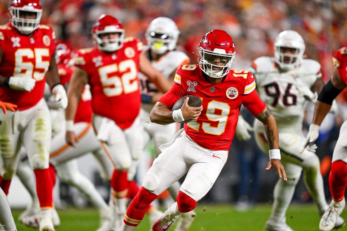 Kansas City Chiefs quarterback Chris Oladokun (19) runs with the ball during the first half of the game against the Denver Broncos at GEHA Field at Arrowhead Stadium on Thursday, Dec. 25, 2025.
