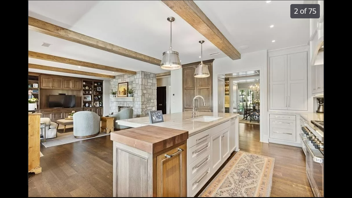 The kitchen, family and dining rooms are all connected with open entryways on the main floor at 9241 High Drive in Leawood.