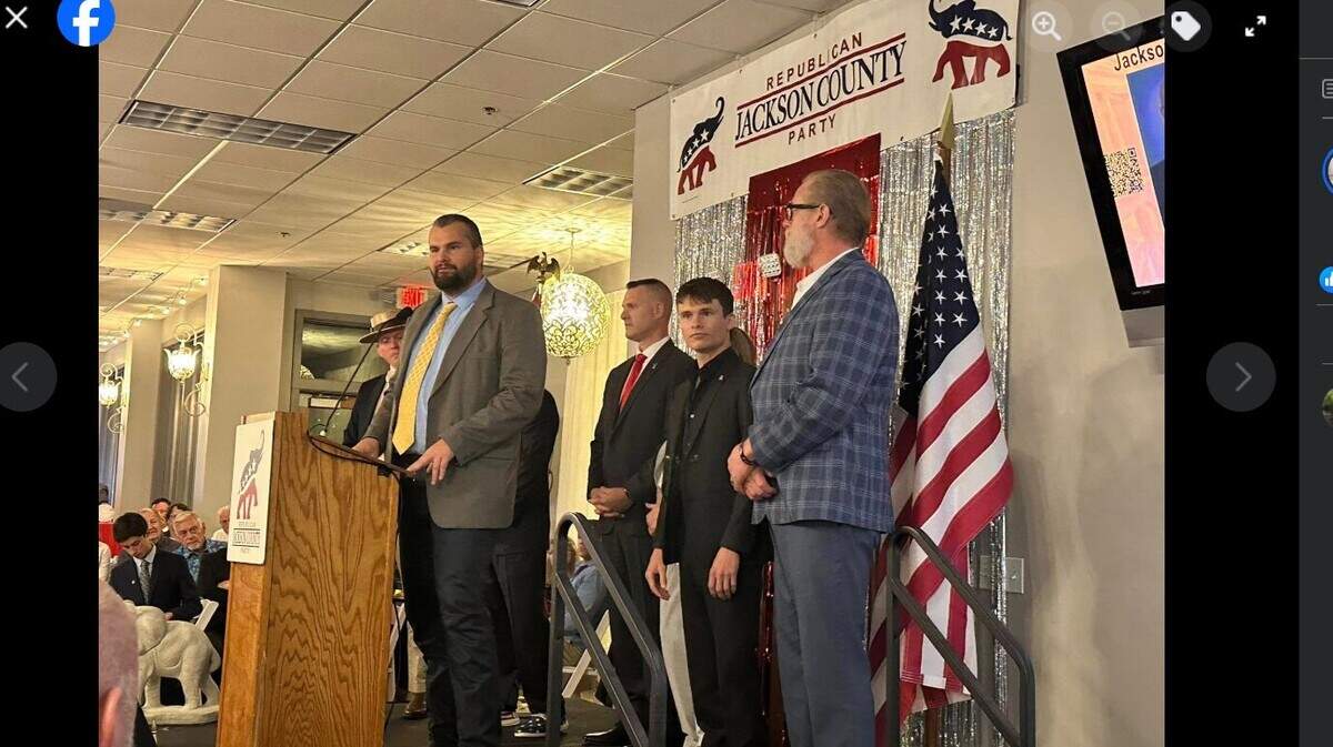 Jan. 6 defendant Will Pope, of Topeka, speaks at the Lincoln-Reagan Day Dinner sponsored by the Jackson County Republican Party on April 12. To his right are other Jan. 6 defendants Christopher Kuehne, formerly of Olathe; Angelo Pacheco, of Kansas City; and William Chrestman, of Olathe. Isaac Yoder, of Nevada, is on Pope’s left.