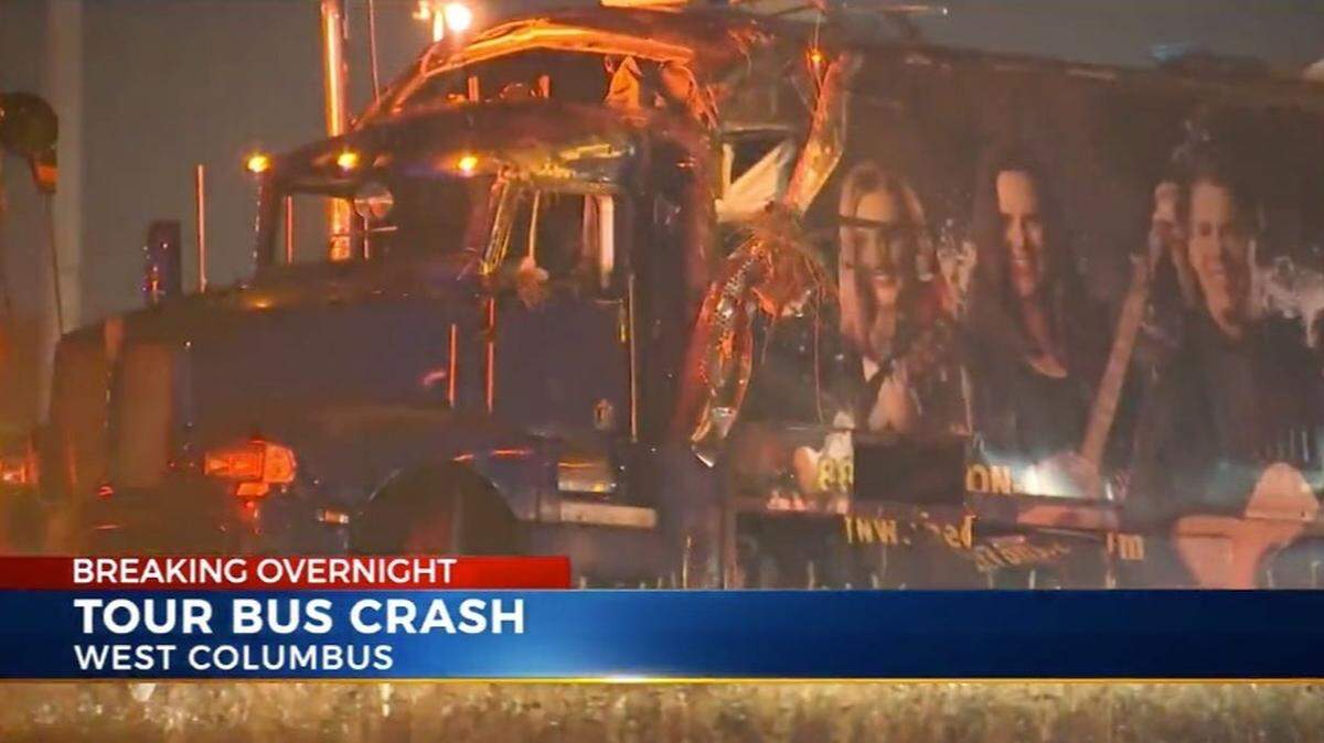 A Branson, Missouri, band’s tour bus overturned Friday with 23 people on board, injuring four, police said. Screengrab from WCMH.