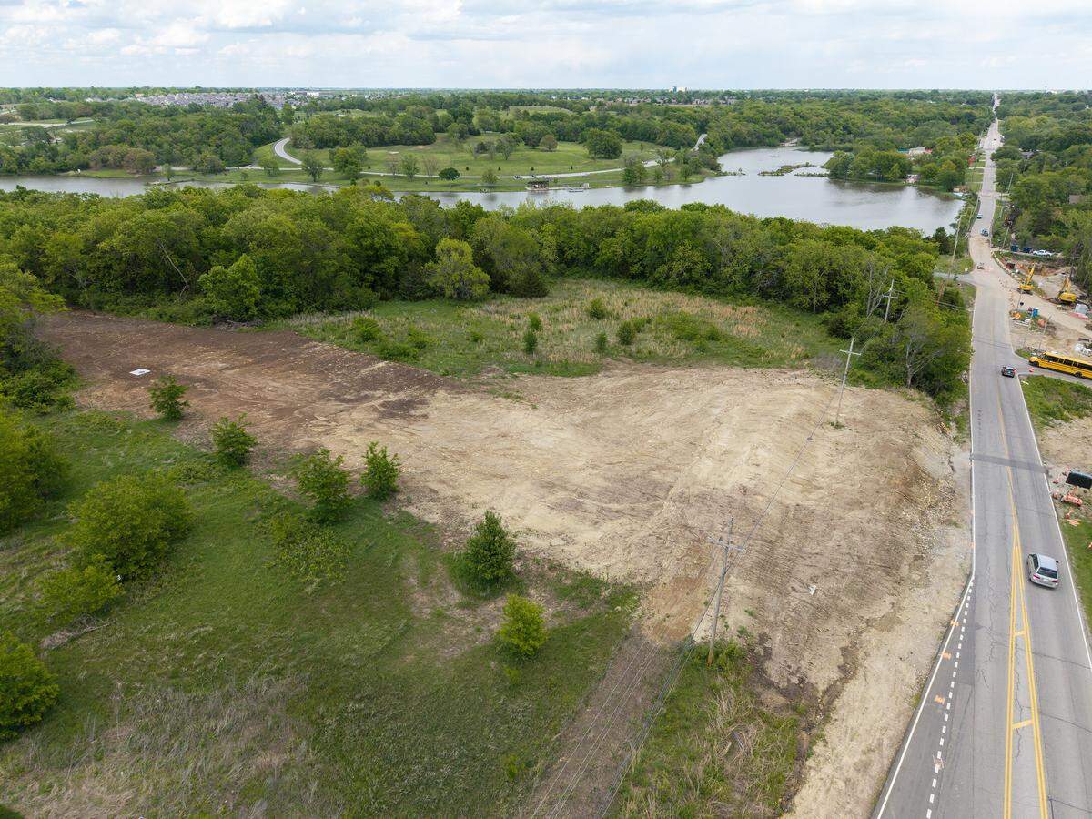 Land on the north side of 143rd Street, near S. Lakeshore Dr., near Lake Olathe on Friday, May 2, 2026, in Olathe. The view is looking east.