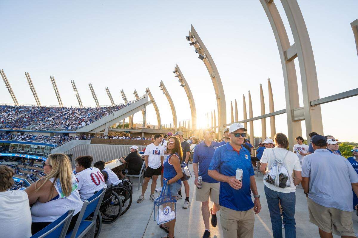 Crowds walk the newly built view terrace during the halftime show inside the newly remodeled David Booth Kansas Memorial Stadium during the Jayhawks game vs. the Fresno State Bulldogs on Saturday, Aug. 23, 2025, in Lawrence.