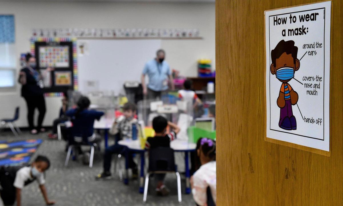 Students arrived at Douglass Elementary School in Kansas City, Kansas, on Wednesday for the first day of full-time, in-person learning. Principal Louis Neal said about 75% of students came back.
