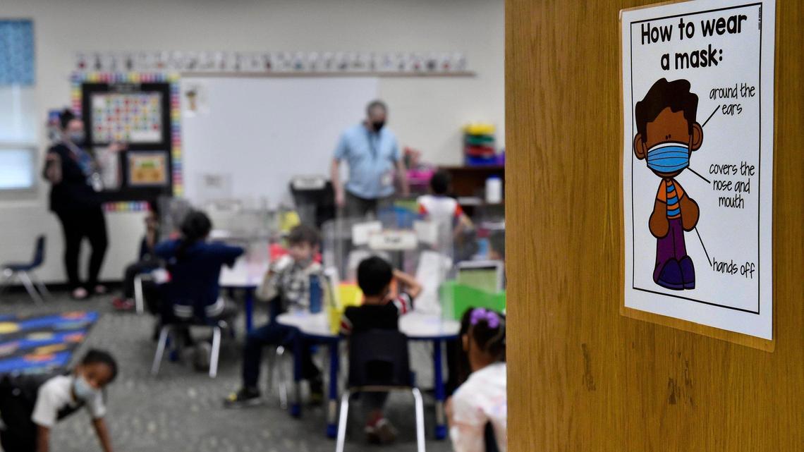 Students arrived at Douglass Elementary School in Kansas City, Kansas, Wednesday, March 31, 2021, for the first day of full-time, in-person learning. Reminders of the coronavirus were all around the school.