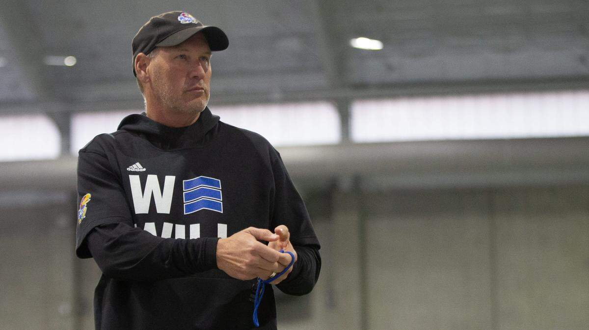 Kansas head coach Lance Leipold motions toward reporters during a spring practice in March of 2023.