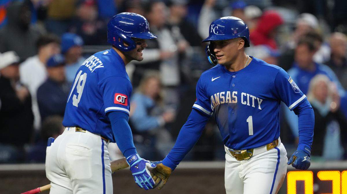 Isaac Collins #1 of the Kansas City Royals celebrates his solo home run with Michael Massey #19 in the sixth inning against the Cleveland Guardians at Kauffman Stadium on May 5, 2026 in Kansas City.