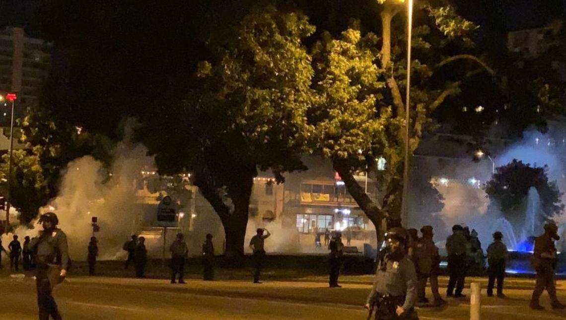 Kansas City police deployed tear gas Monday night near the J.C. Nichols Memorial Fountain at the Country Club Plaza.