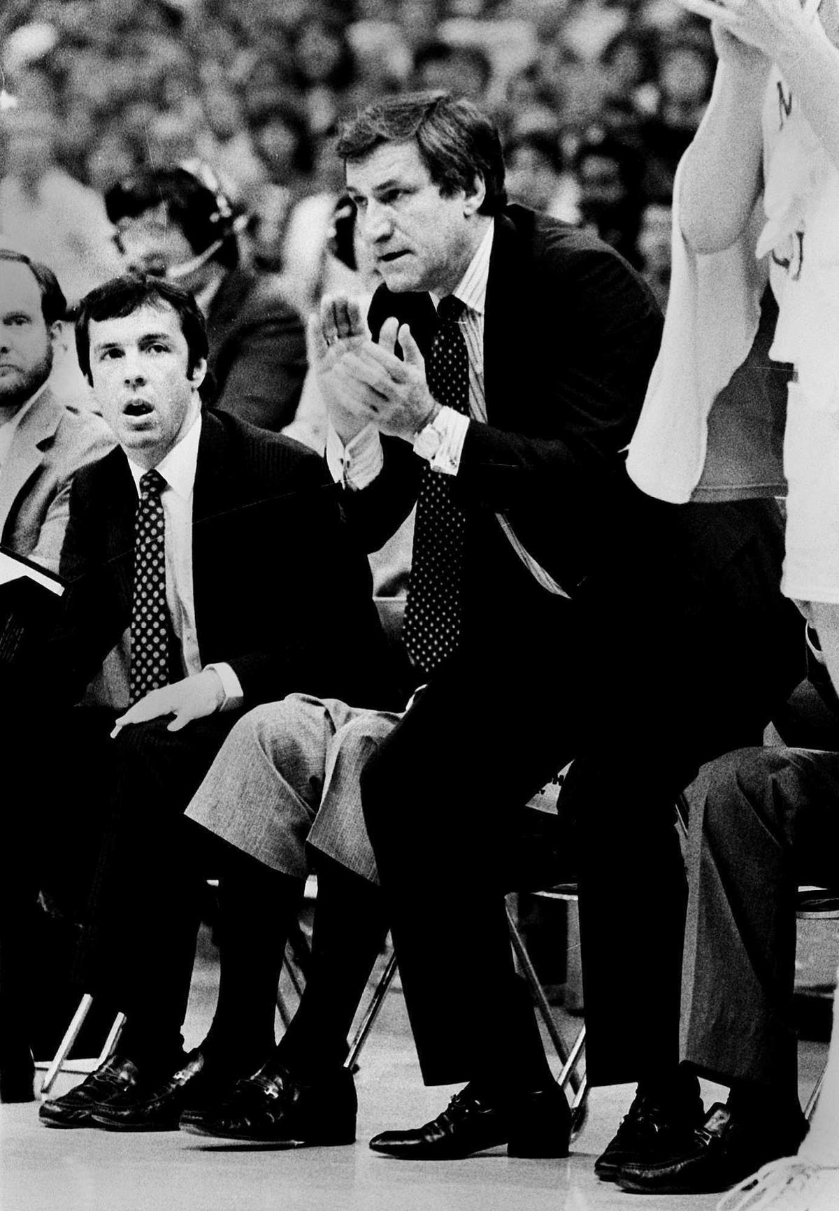 North Carolina assistant coach Roy Williams, left, and head coach Dean Smith, are seen March 30, 1982 during the NCAA championship game against Georgetown at the Superdome in New Orleans.