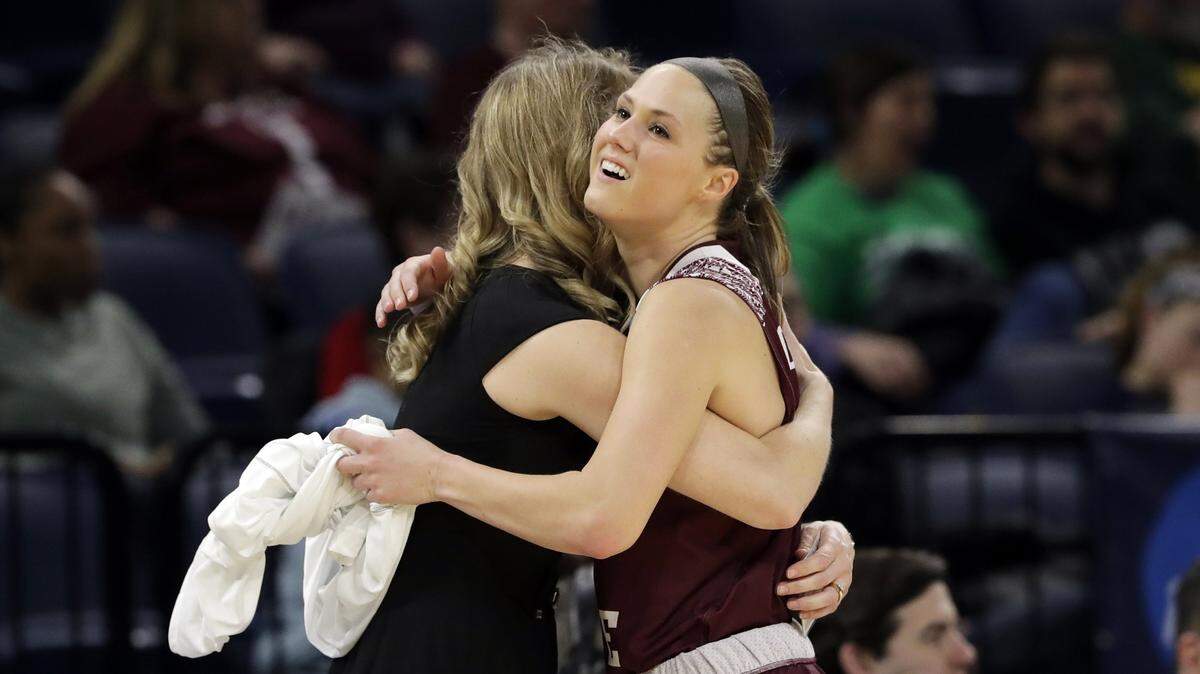Missouri State coach Kellie Harper, left, hugs Danielle Gitzen as Gitzen leaves the game during the second half Saturday.