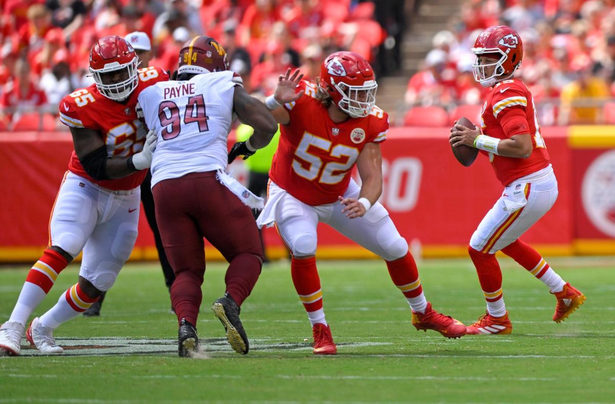 Kansas City Chiefs offensive line Trey Smith (65) and center Creed Humphrey (52) block Washington Commanders Daron Payne (94) in the first half on Saturday, Aug. 20, 2022, at Arrowhead Stadium in Kansas City.