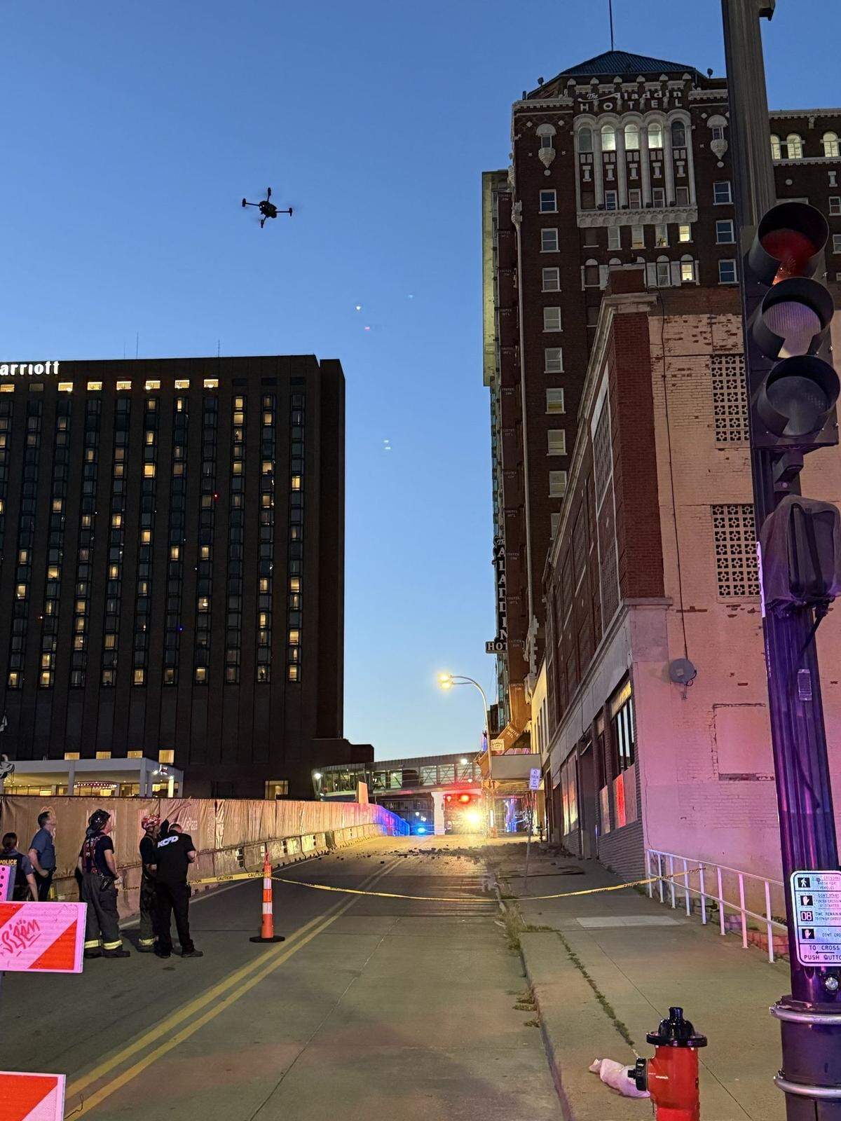 Firefighters used a crew to inspect a downtown Kansas City parking garage after part of the brick facade separated from the building and fell to the street and sidewalk below on Tuesday evening, a fire department spokesman said. Firefighters also used the drone to search the building, which came back clear.