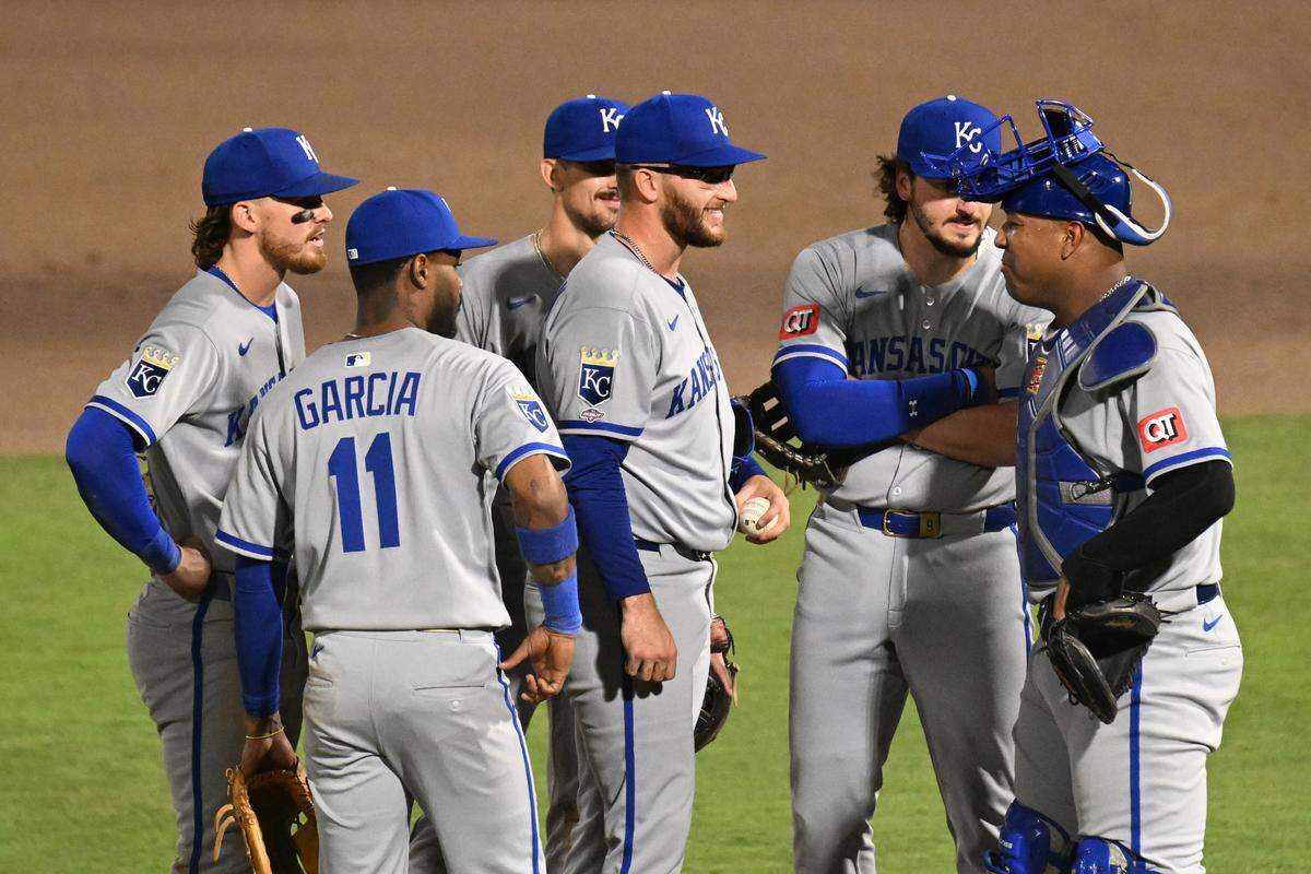 Kansas City Royals starting pitcher Noah Cameron (65) reacts as his teammates join him on the mound after he gave up his first hit of the night in the seventh inning against the Tampa Bay Rays at George M. Steinbrenner Field on April 30, 2025 in Tampa, Florida.