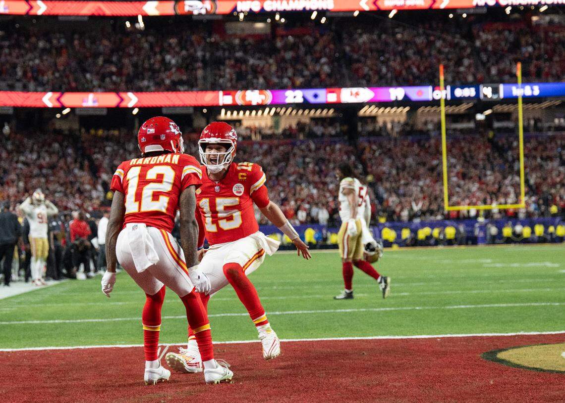Kansas City Chiefs quarterback Patrick Mahomes (No. 15) celebrates with receiver Mecole Hardman Jr. after the team’s thrilling overtime victory over the San Francisco 49ers in Super Bowl LVIII.