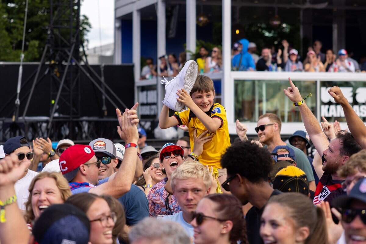 A member of the crowd catches Flo Rida's signed shoe during their FIFA Fan Fest concert at Fan Fest on Friday, June 19, 2026.