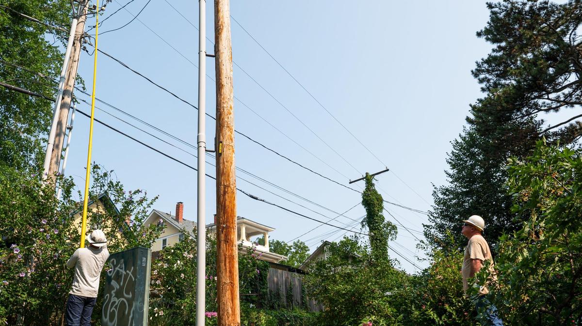 Evergy crews worked to restore power to residents in the Hyde Park neighborhood after severe storms rolled through the Kansas City metro earlier this month. Storms on Sunday evening again knock out power to more than 80,000 Evergy customers.