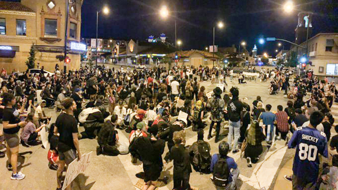 Kansas City police block traffic as demonstrators march around Country Club Plaza