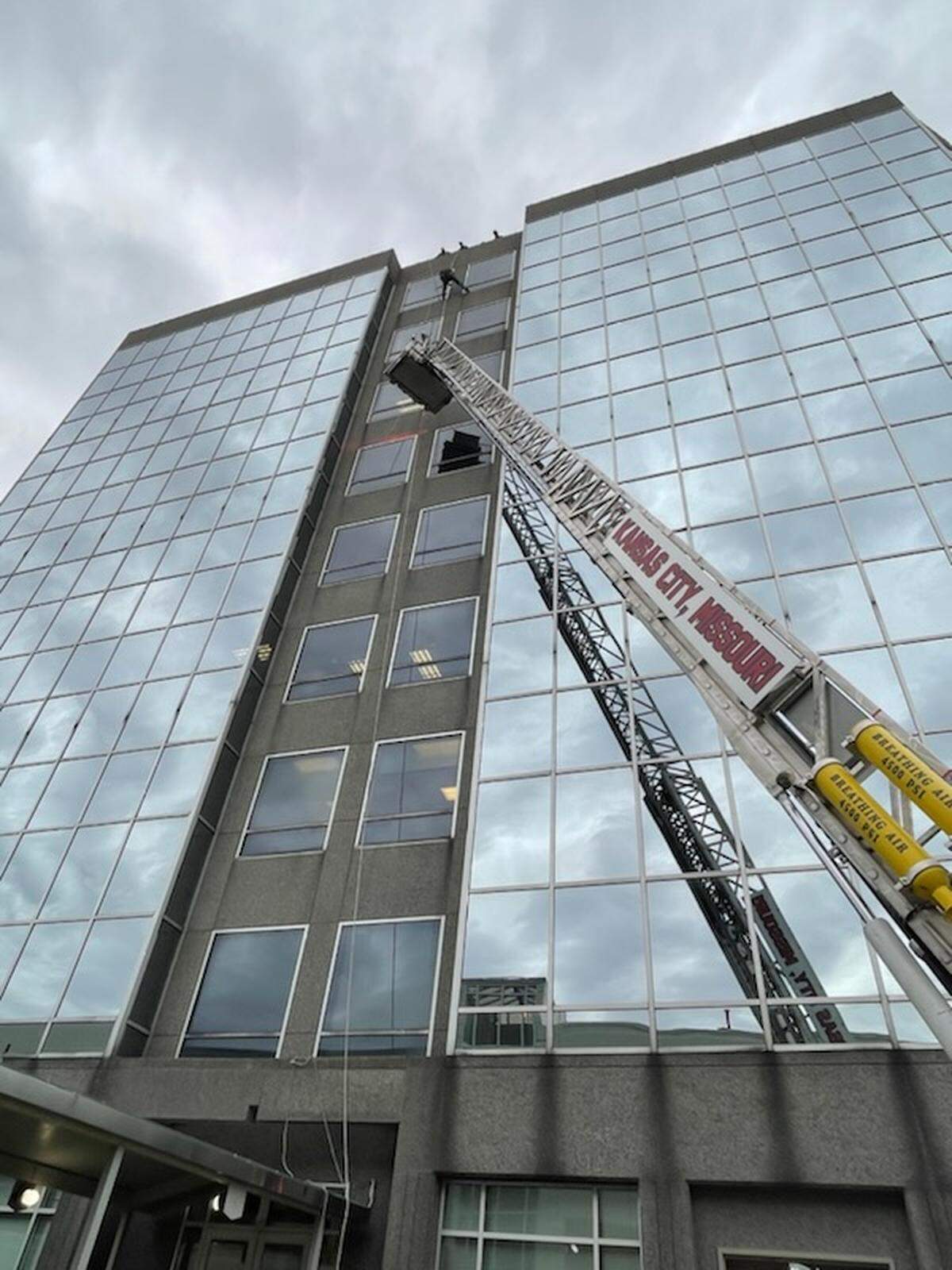 Firefighters tried to use a ladder truck with an aerial platform to rescue a window washer stuck on the side of a building at 903 E. 104th Street, south of Interstate 435 near Homes Road, in south Kansas City. The ladder was not able reach the height needed to rescue him, a fire department spokesman said. A rescue firefighter went off the roof and attached another line to the worker, who was lowered down.