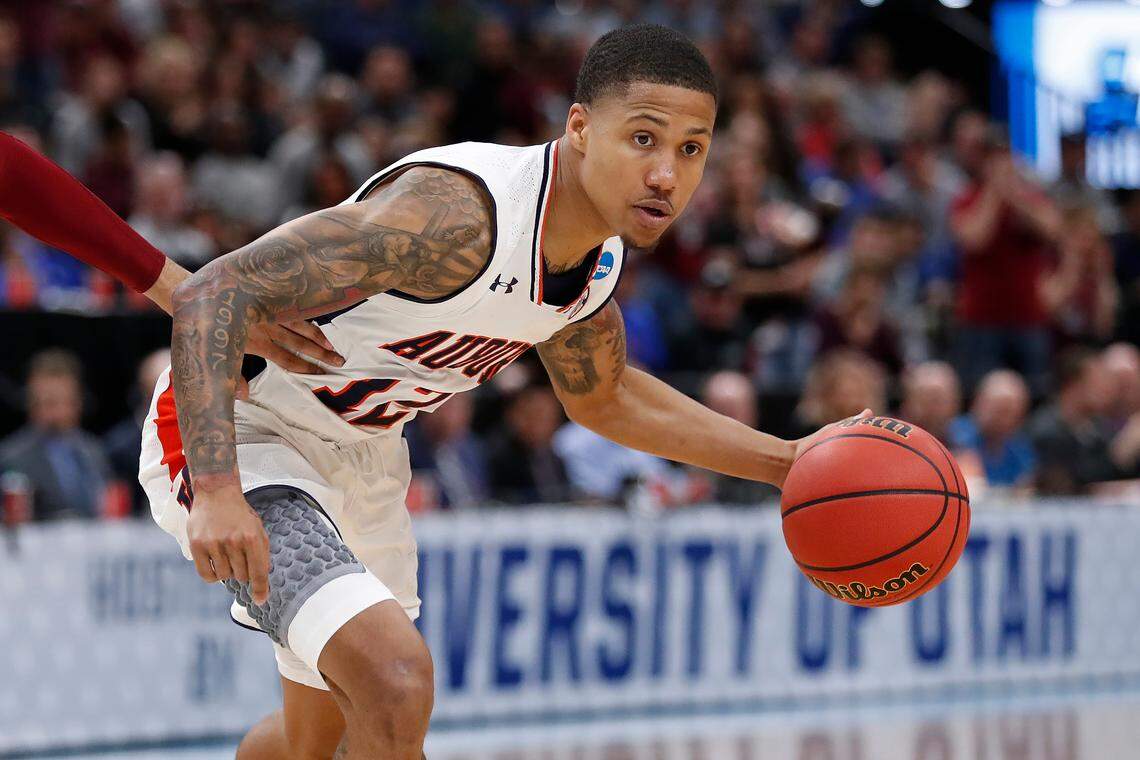Auburn guard J’Von McCormick (12) plays against New Mexico State during a first round men’s college basketball game in the NCAA Tournament Thursday, March 21, 2019, in Salt Lake City. (AP Photo/Jeff Swinger)