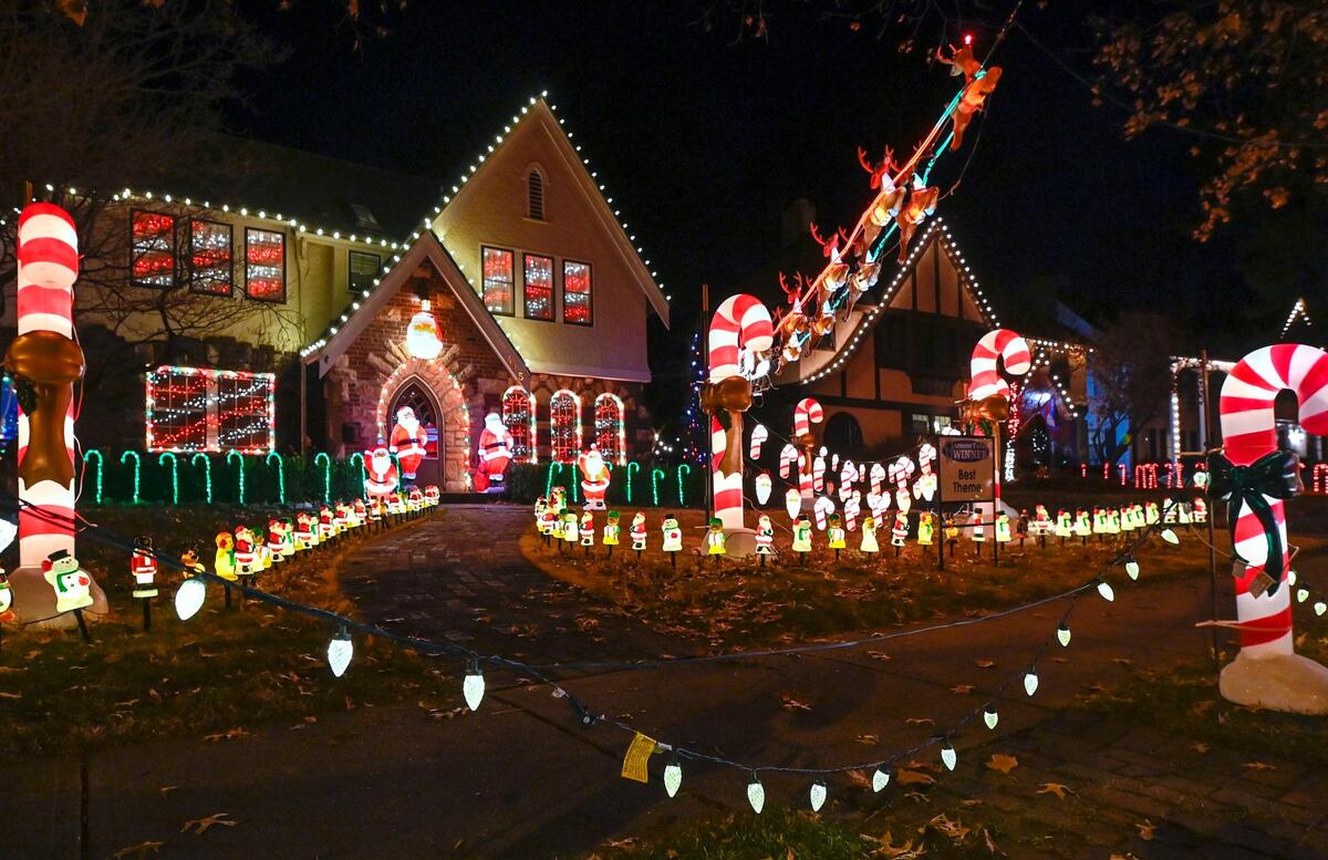 A candy cane-themed light display is one of several elaborate holiday displays on West 68th Terrace near Wornall Road in the Armour Fields neighborhood of Kansas City.