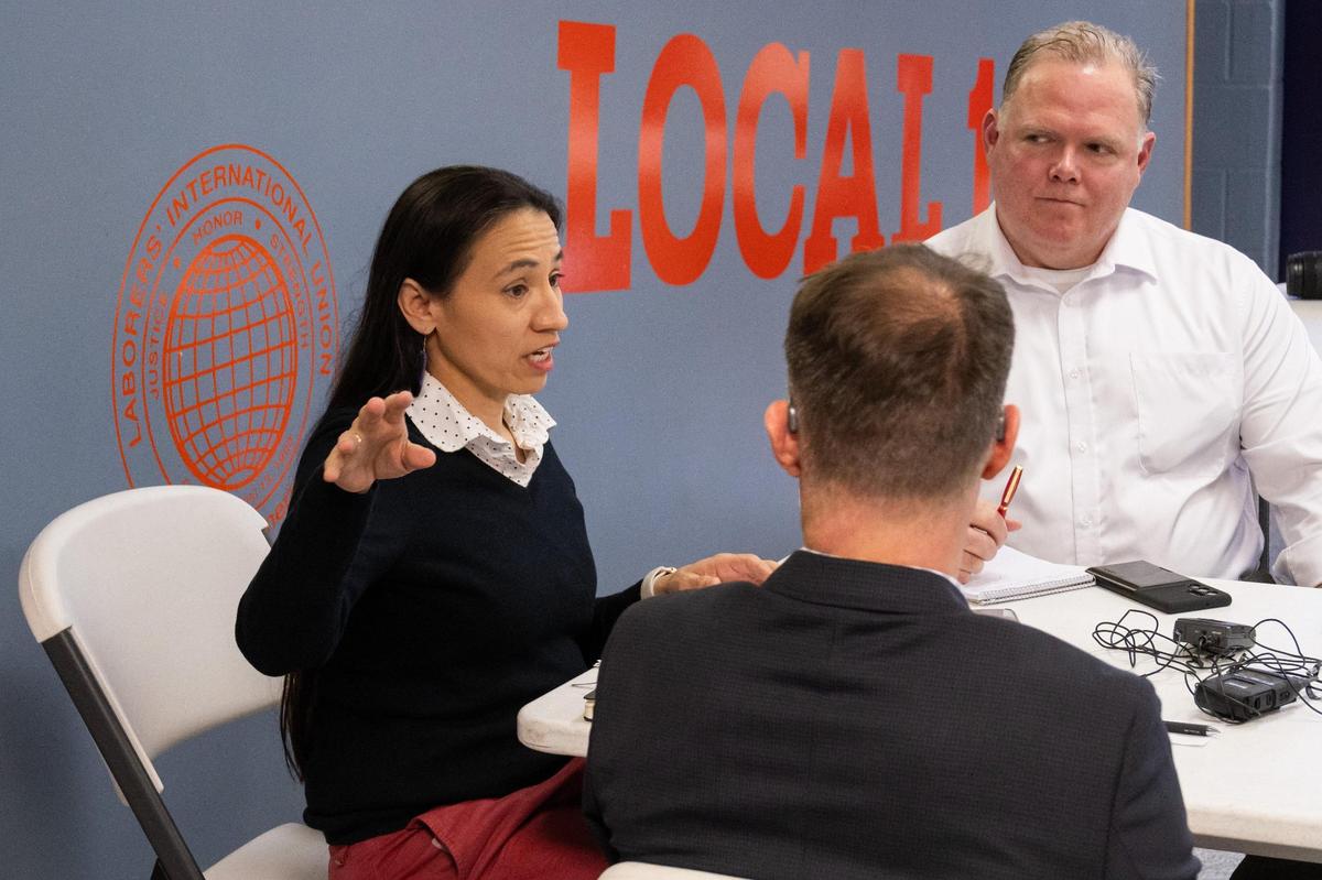 Kansas Rep. Sharice Davids meets with recently fired federal workers at LiUNA Local 1290 Union Hall in Merriam on Friday, Mar. 7, 2025. Kansas City, a major hub for federal employment, is experiencing widespread impacts from government layoffs.