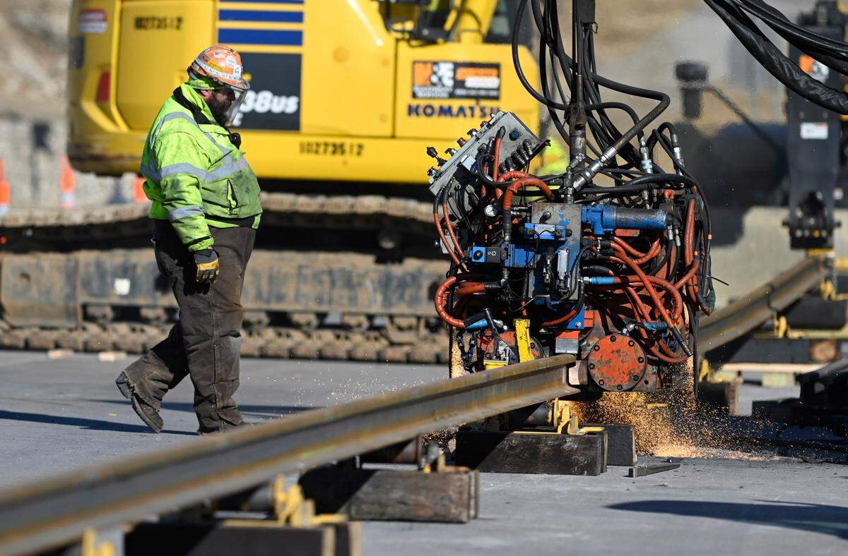 Using a a technique called electric flash-butt welding, workers from Holland Welding of Crete, Illinois, and KC Streetcar Constructors on Wednesday began welding together steel rails for the KC Streetcar Main Street extension. Welders will heat the rails to 2,800 degrees and create multiple 400-foot sections of rails. The KC Streetcar Main Street extension will run from Union Station to UMKC, at 51st Street and Brookside Boulevard.
