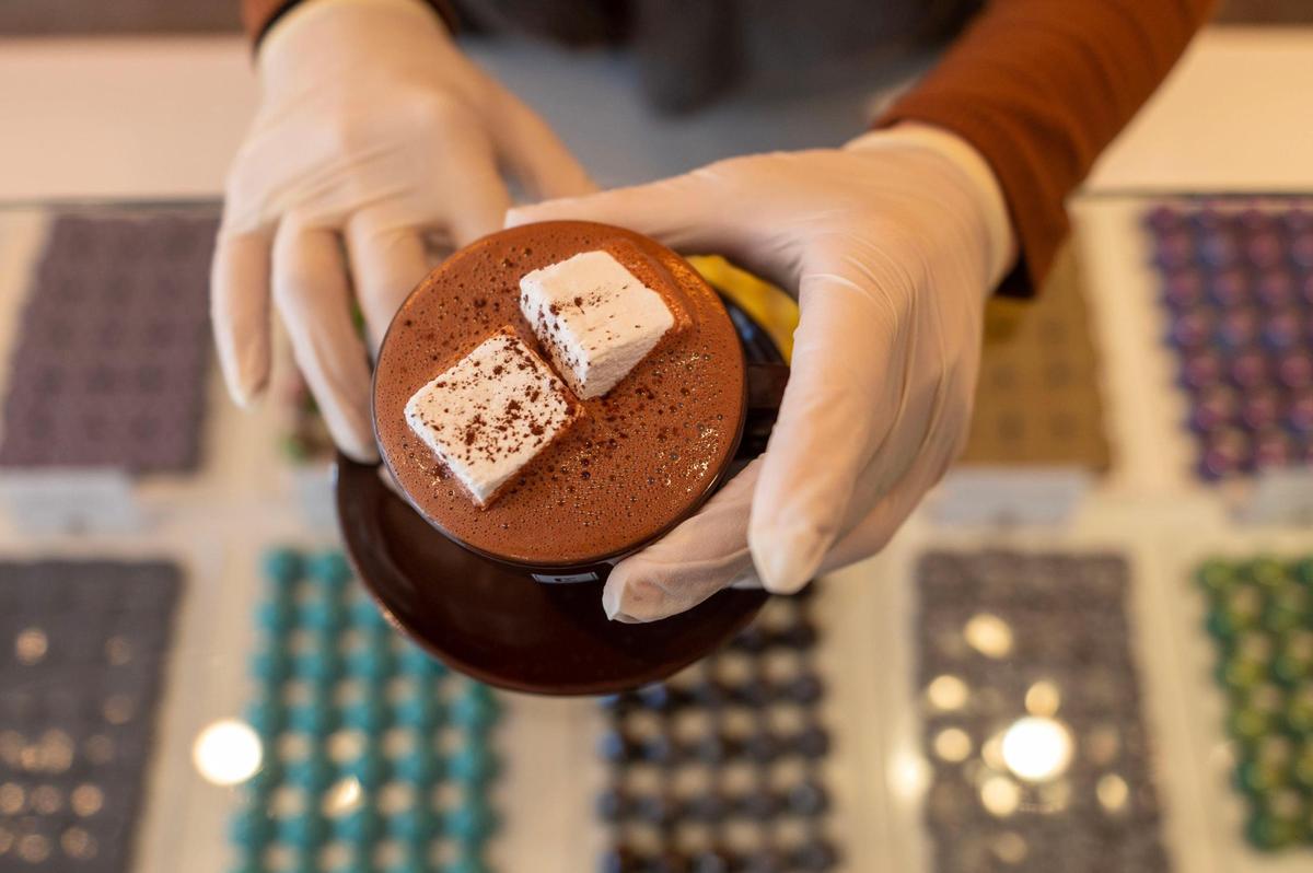 Ami Ward prepares a Cocoa Noir hot chocolate with house-made marshmallows at Christopher Elbow Chocolates in November 2022 in Kansas City.