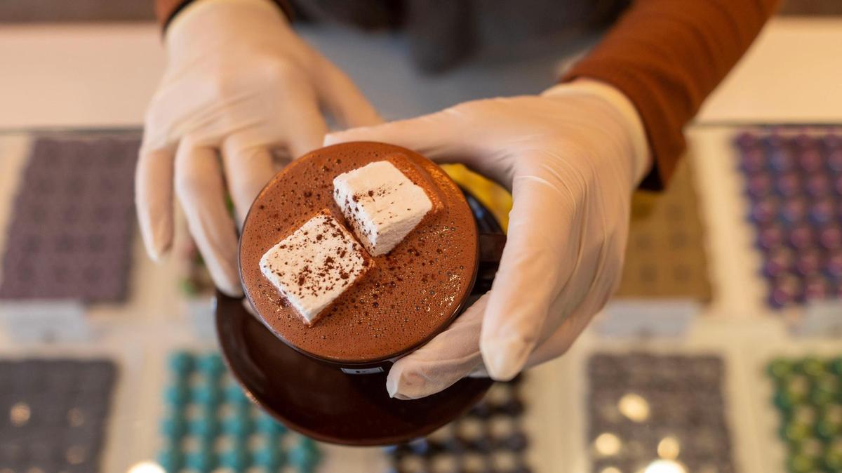 Ami Ward prepares a Cocoa Noir hot chocolate with house-made marshmallows at Christopher Elbow Chocolates on Monday, Nov. 28, 2022, in Kansas City.