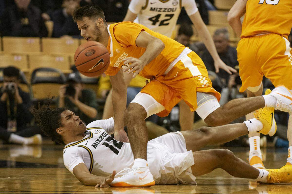 Tennessee junior guard Santiago Vescovi, top, scored 18 points in his first game against Kentucky as a freshman in 2019-20 but has scored only nine points combined in his three games vs. UK since.