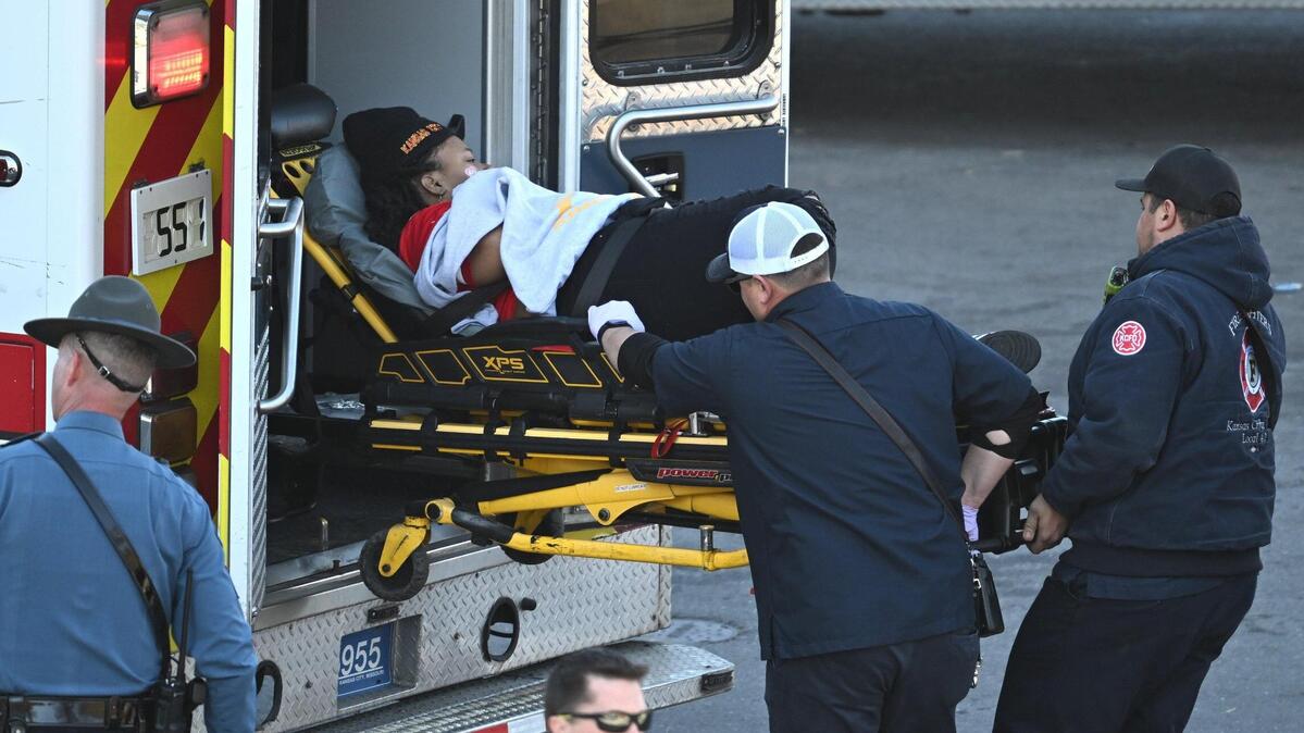Medical personnel load a woman into an ambulance after a shooting at Union Station after the Kansas City Chiefs Super Bowl LVIII victory parade on Wednesday, Feb. 14, 2024, in Kansas City.