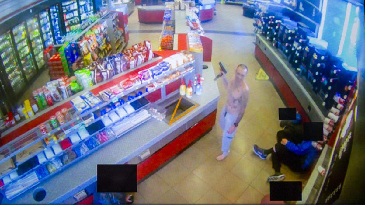 Surveillance footage released by Johnson County District Attorney Steve Howe shows a man, identified as Brett Marshall Smiley, who fired a gun at a Shawnee QuikTrip location and was later shot by police.