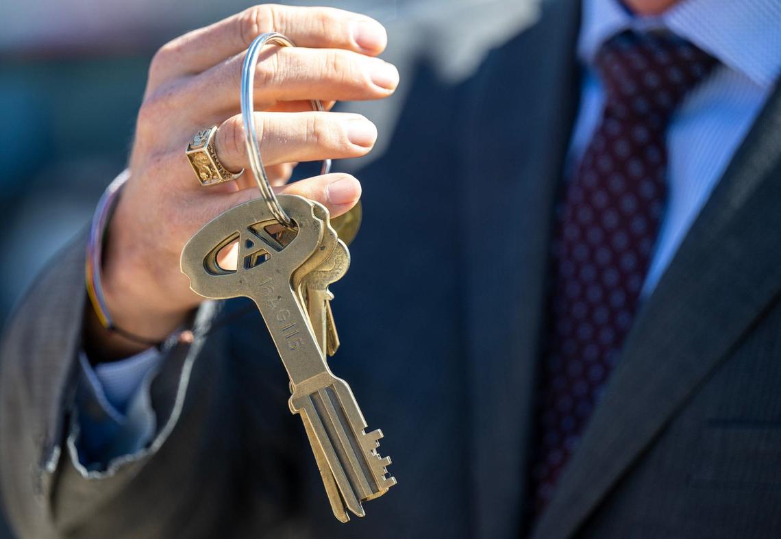 Outside of the Lansing Correctional Facility, Kansas Sen. Jeff Pittman, who was instrumental in the preservation of the prison, holds up the keys to the prison which were transferred to The Lansing Historical Society and Museum on Monday.
