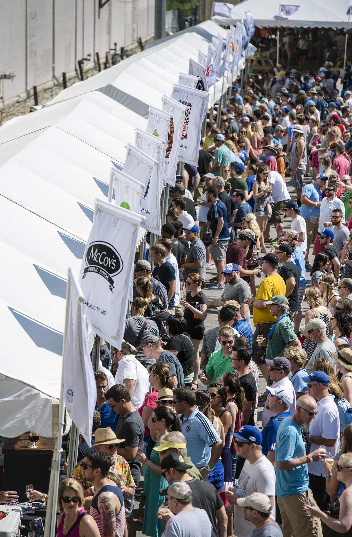 Crowds line up for samples at the Taps & Taste event on Saturday, June 20, 2015, during Boulevardia in the West Bottoms.