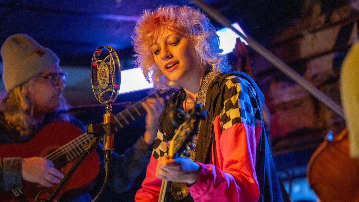 Nora Bell, 15, sang a protest song Monday night at the Rural Grit Happy Hour at The Brick as part of an organized opposition to the Royals’ plan to put a stadium in the Crossroads.