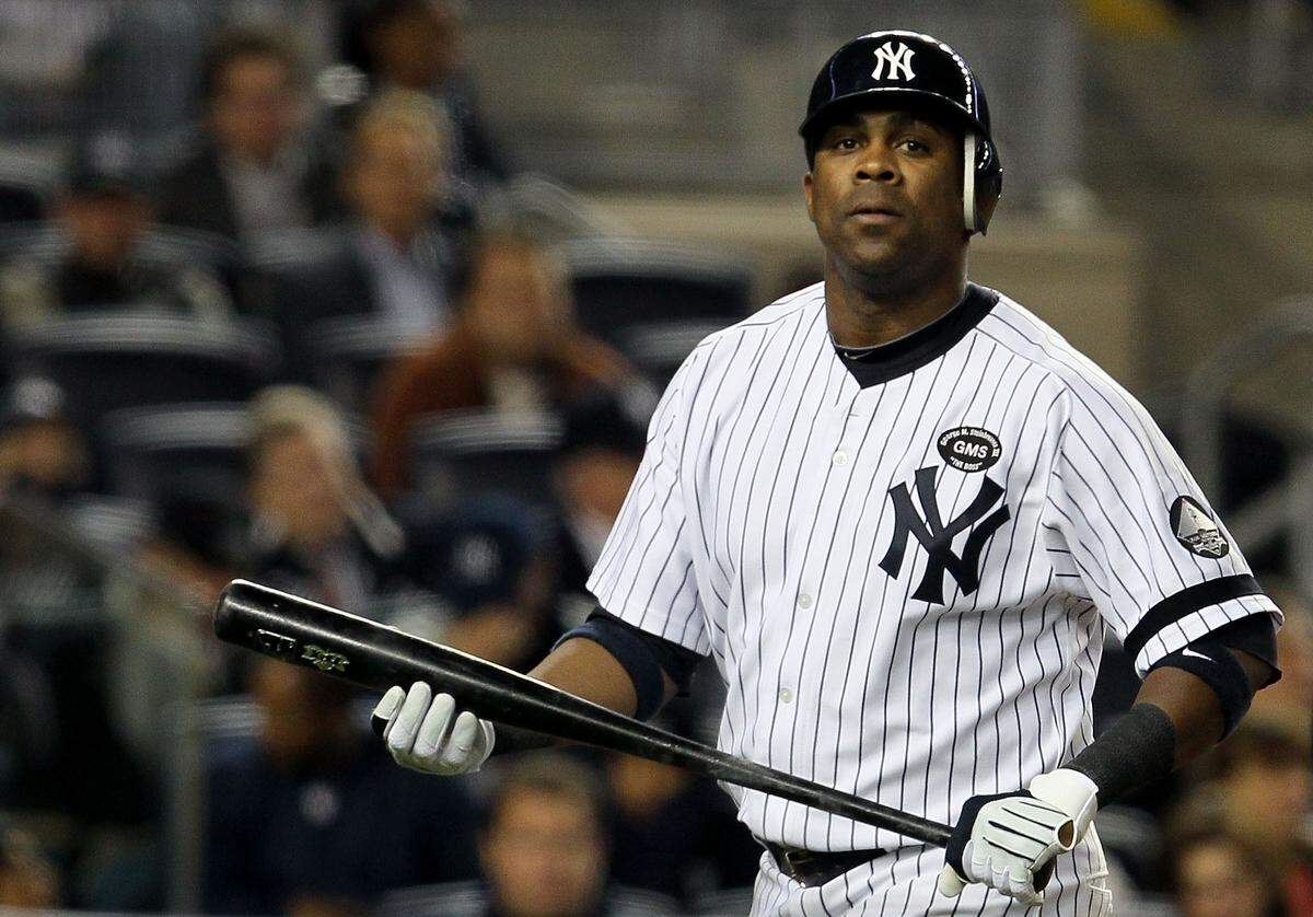 Marcus Thames #38 of the New York Yankees reacts after he struck out in the bottom of the eighth inning against the Texas Rangers in Game 4 of the ALCS during the 2010 MLB Playoffs at Yankee Stadium on October 19, 2010.