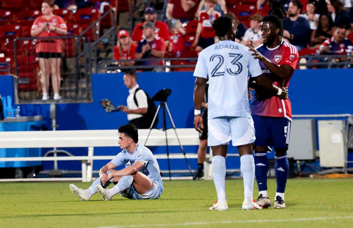 Sporting Kansas City players Manu Garcia (21) and William Agada (23) react after the game against FC Dallas at Toyota Stadium on March 29, 2025.