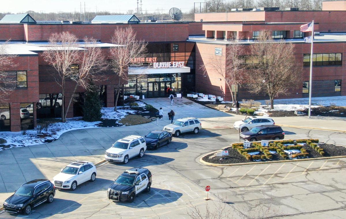 Students headed into Olathe East High School on Wednesday morning, five days after gunfire wounded an administrator, a school resource officer and a student. The student, a senior, has been charged with attempted capital murder.