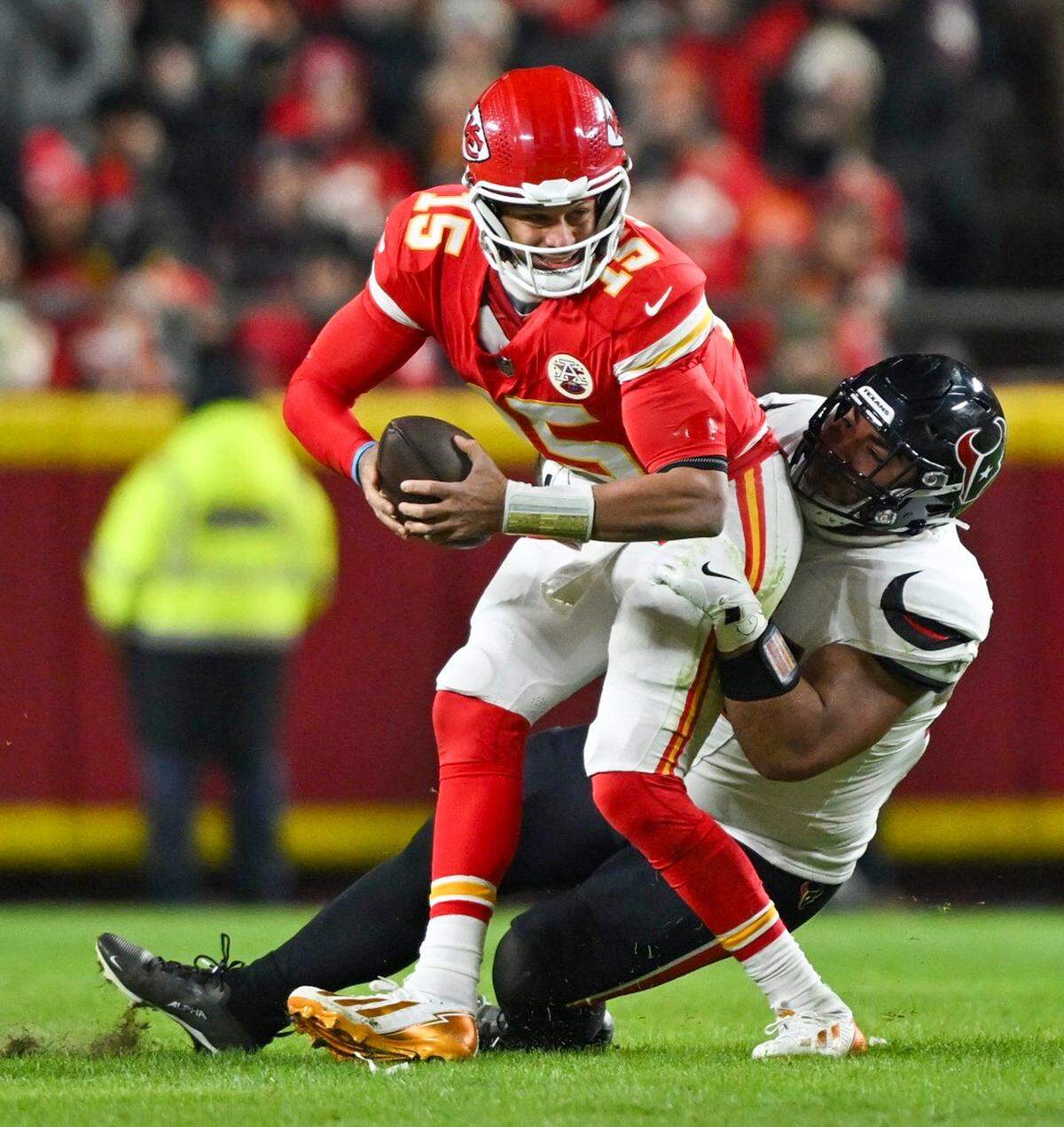 Kansas City Chiefs quarterback Patrick Mahomes (15) gets sacked during the game against the Houston Texans at GEHA Field at Arrowhead Stadium on Sunday, Dec. 7, 2025.