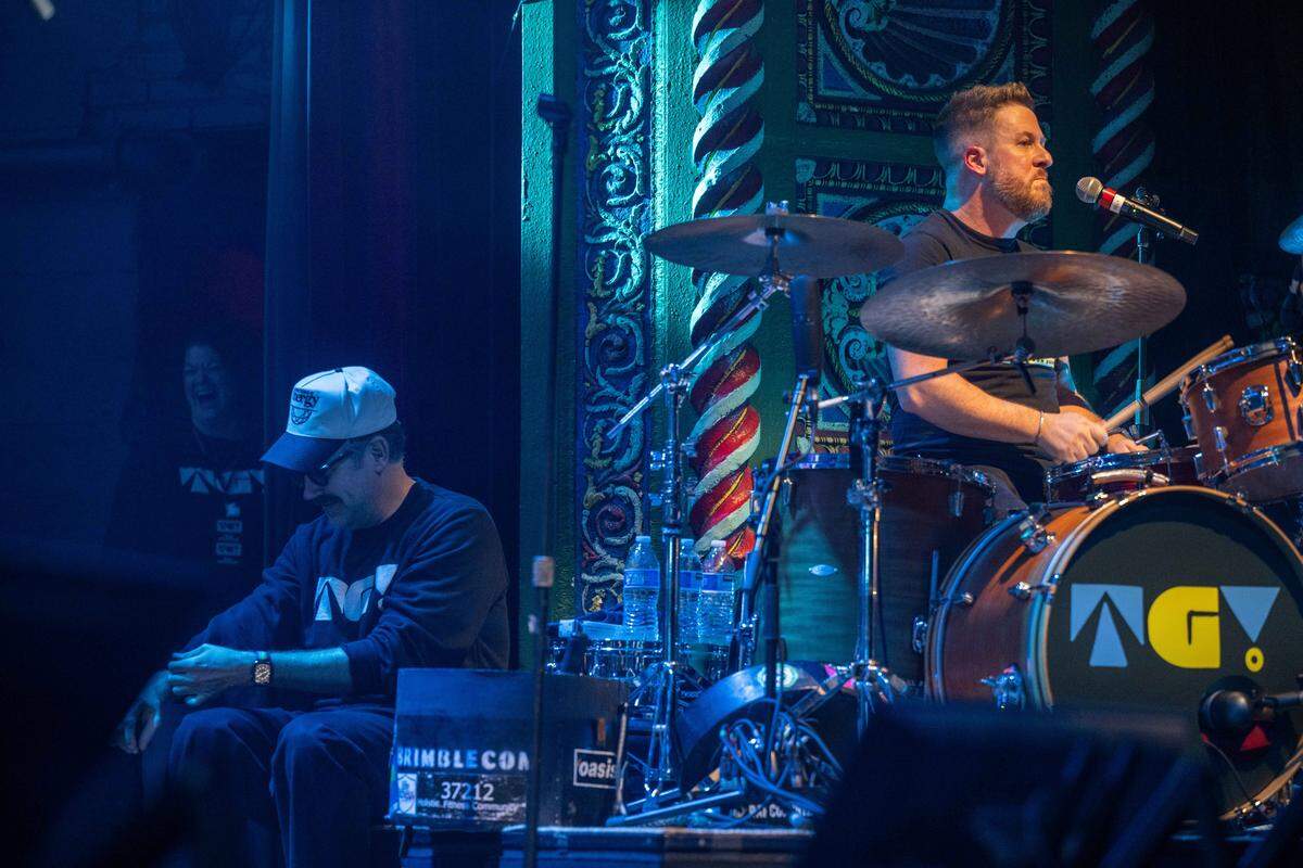 Steps of Faith Foundation CEO Billy Brimblecom performs on the drums as actor/comedian Jason Sudeikis listens at Thundergong! on Saturday, November 8, 2025, at Uptown Theater in Kansas City. The annual fundraiser was hosted by Jason Sudeikis and featured live music performances and moments of comedy.