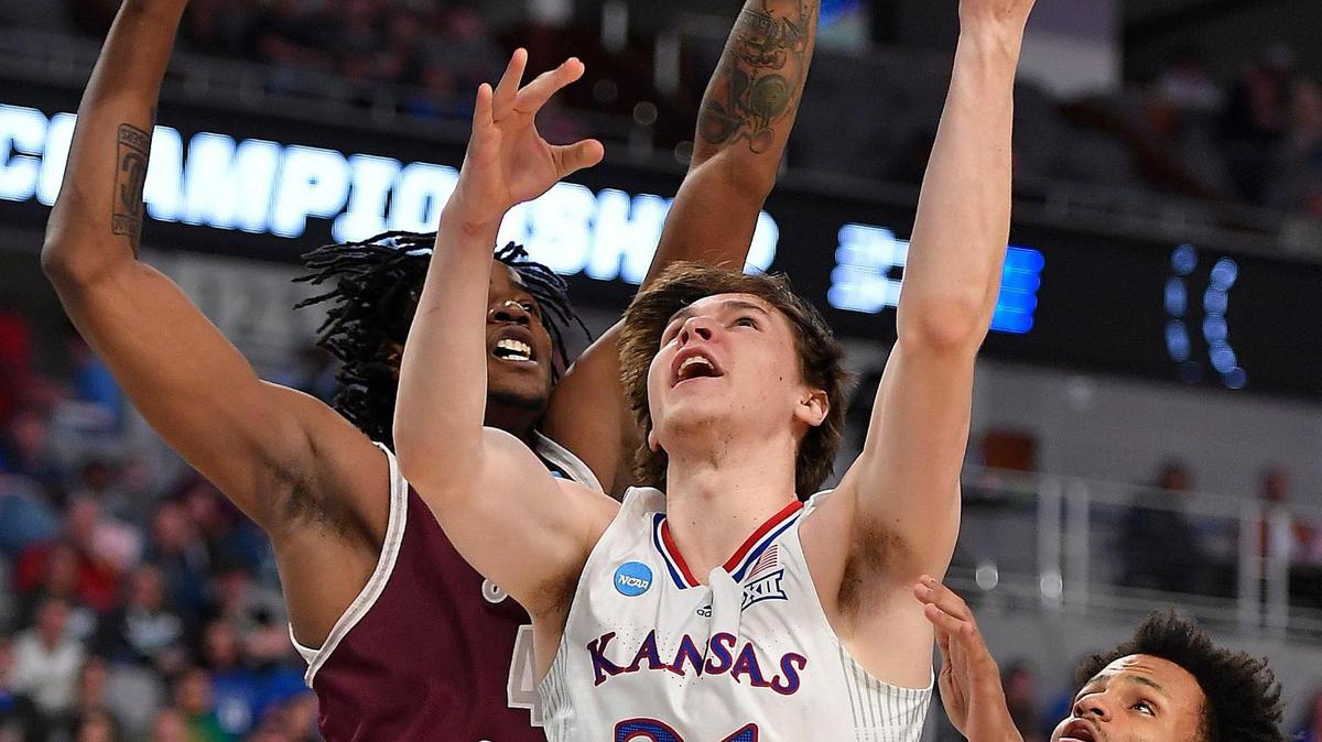 KU’s Zach Clemence scores between Texas Southern’s Bryson Etienne and Jordan Gilliam during the first half of Thursday night’s first round NCAA Tournament game in Fort Worth.
