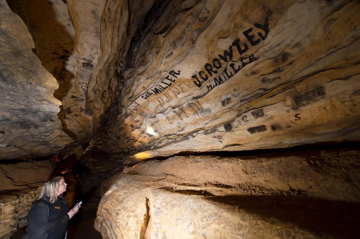 Tour guide Jessica Bonvillain points out some of the 250,000 signatures along the six miles of walls in the Mark Twain Cave in Hannibal. The cave plays a prominent role in Mark Twain’s “The Adventures of Tom Sawyer” and is considered the oldest show cave in Missouri, with the first guided tour in 1886.