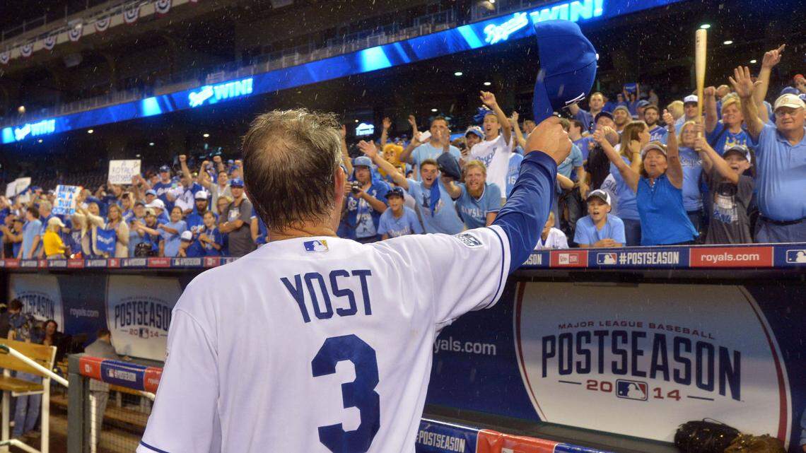 Kansas City Royals manager Ned Yost (3) tips his hat to fans after defeating the Oakland Athletics in the 2014 American League Wild Card playoff baseball game at Kauffman Stadium on Sept. 30, 2014.